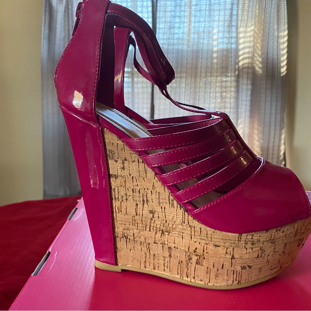 Tamala 5 inch wedge heel in the color Magenta. Ankle strap with zipper back